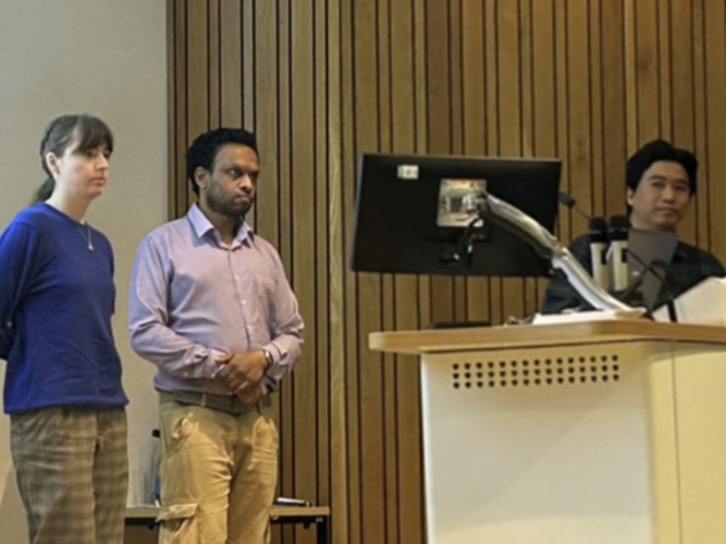 a photo of zitzmann lab presenting.