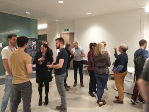 Debora Marks chatting with Kavli Team members during the drinks reception