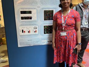 A photograph of Remya Raghavan Nair with her poster.