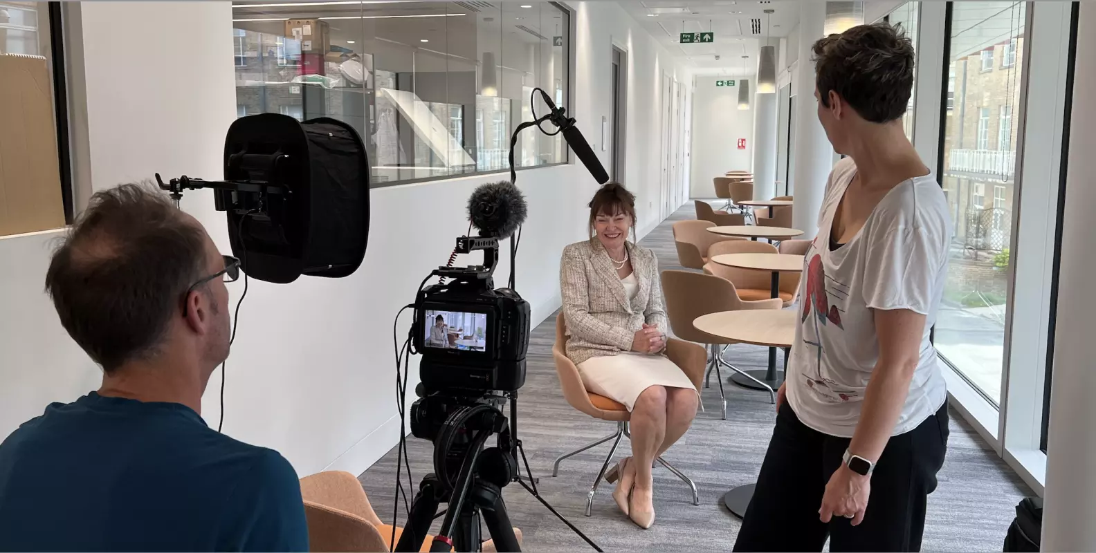 A photograph of Carol Robinson being interviewed.