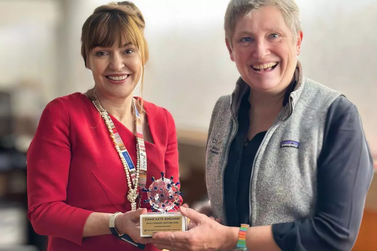 Carol presenting the award to Kate